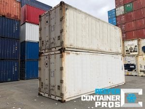 Two Used 20' Refrigerated Shipping Containers Stacked at Intermodal Depot - Reefer Container Pros: Buy & Rent Refrigerated Shipping Containers
